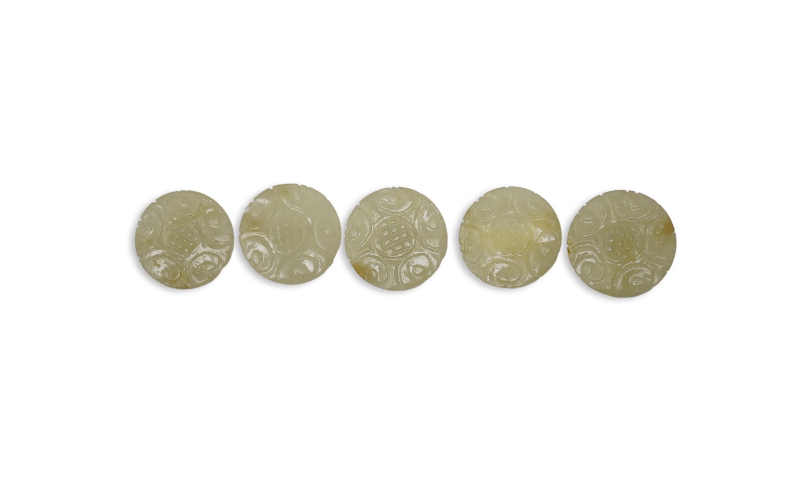 A set of five Chinese pale celadon jade robe buttons, 19th century